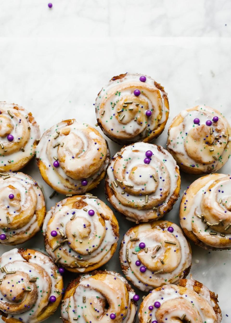 <p>Top these buttery cinnamon rolls with purple, gold and green sprinkles for Mardi Gras!</p><p>Get the <strong><a href="http://thewoodandspoon.com/king-cake-cinnamon-rolls-and-my-favorite-spots-in-new-orleans/" rel="nofollow noopener" target="_blank" data-ylk="slk:King Cake Cinnamon Rolls recipe;elm:context_link;itc:0;sec:content-canvas" class="link ">King Cake Cinnamon Rolls recipe</a> </strong>from Wood and Spoon. </p>