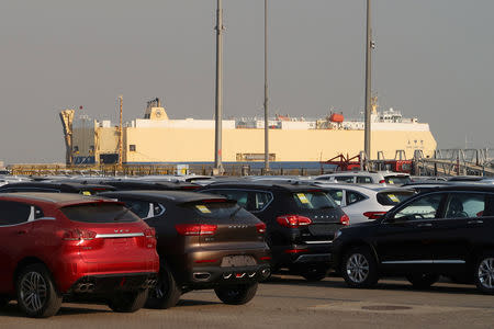 Cars are seen in front of a cargo vessel at a ro-ro terminal in Tianjin port, China January 2, 2019. Picture taken January 2, 2019. REUTERS/Yilei Sun Antara Foto/via REUTERS