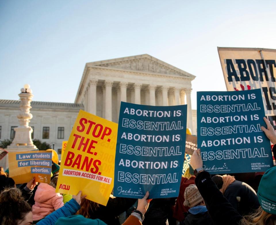 Abortion rights supporters rally as the U.S. Supreme Court hears oral arguments in the Mississippi case  (AP)