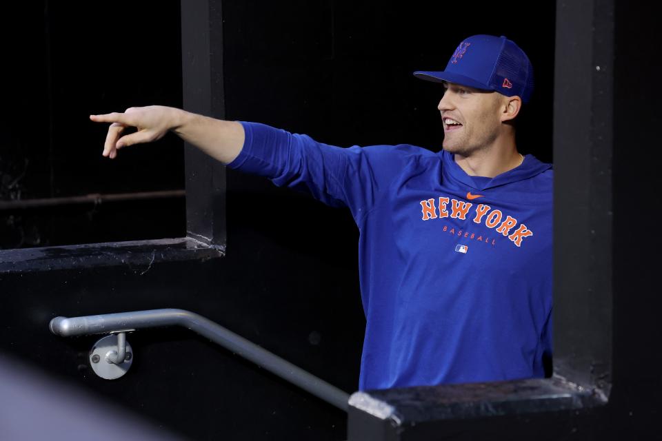 New York Mets center fielder Brandon Nimmo (9) watches as members of the grounds crew attempt to dry the field during a delayed start before a game between the Mets and Miami Marlins on Sept. 26, 2023, at Citi Field.