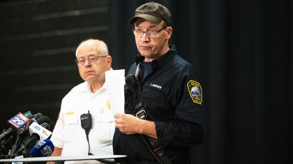 Upper Makefield Fire Chief Tim Brewer, right, stands by Upper Makefield Chief of Police Mark Schmidt as Brewer updates reporters on the search for two missing children swept away by floodwaters last Saturday, during a press conference held at the Washington Crossing United Methodist Church in Washington Crossing, PA.