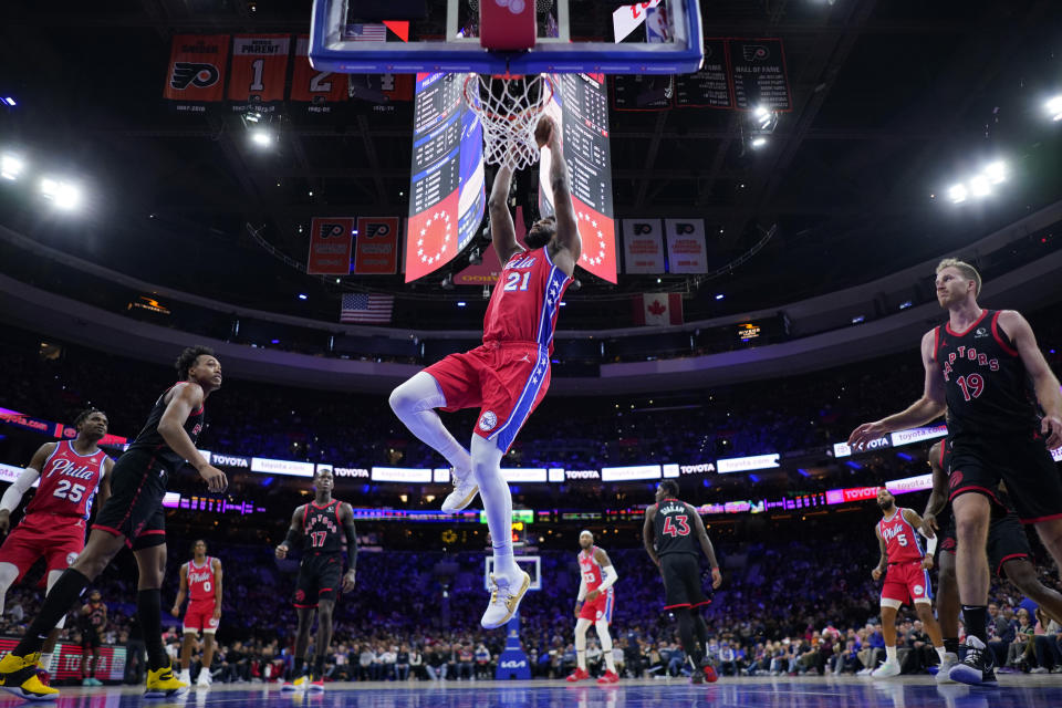 Philadelphia 76ers' Joel Embiid dunks during the second half of an NBA basketball game against the Toronto Raptors, Friday, Dec. 22, 2023, in Philadelphia. (AP Photo/Matt Slocum)