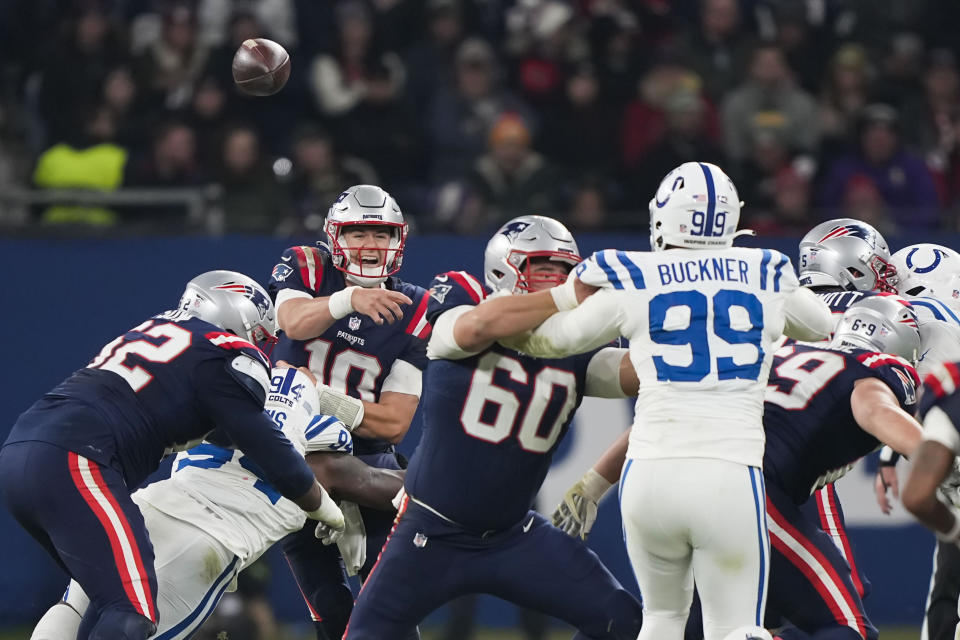 New England Patriots quarterback Mac Jones (10) passes under pressure in the second half of an NFL football game against the Indianapolis Colts in Frankfurt, Germany Sunday, Nov. 12, 2023. (AP Photo/Martin Meissner)