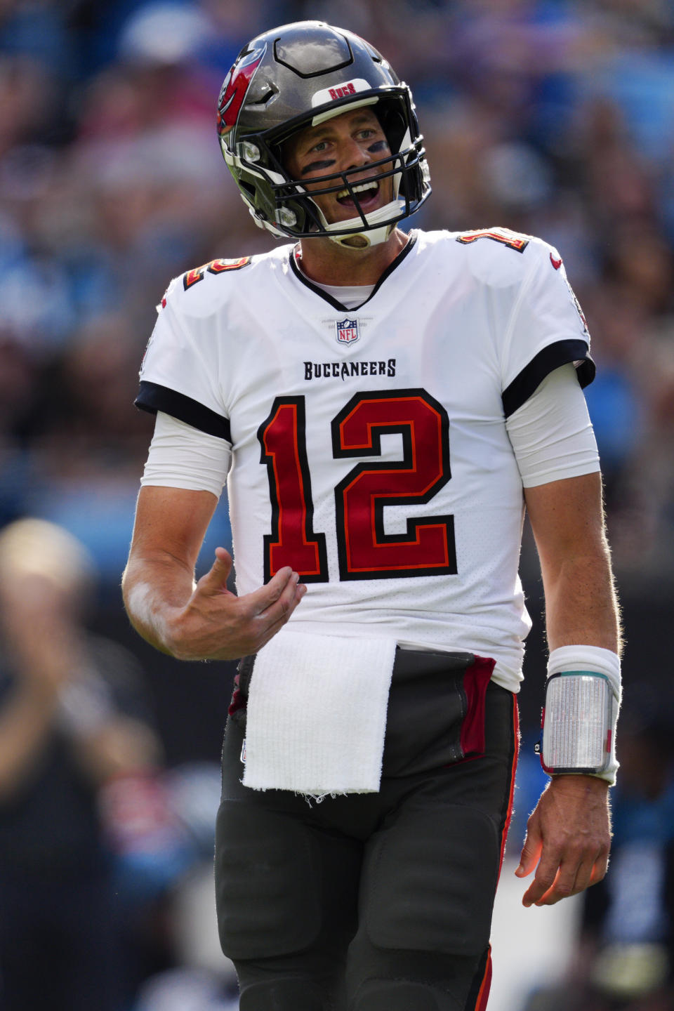 Tampa Bay Buccaneers quarterback Tom Brady reacts during the first half of an NFL football game against the Carolina Panthers Sunday, Dec. 26, 2021, in Charlotte, N.C. (AP Photo/Jacob Kupferman)