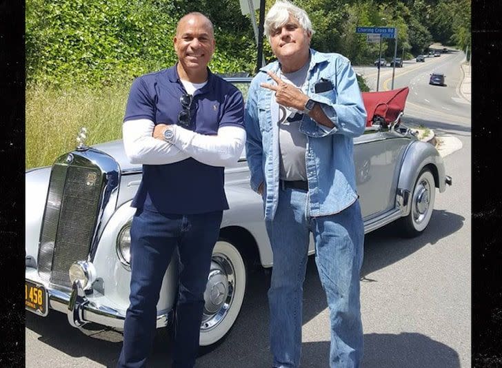 <img src="jay-leno-1.jpg" alt="Jay Leno helps stranded motorist Dwayne Henry with his 1953 Mercedes-Benz">