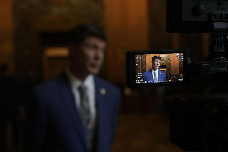 Louisiana Rep. Raymond Crews, who wrote a bill that would ban schools' use of a child's preferred pronouns without parental permission, speaks to the Associated Press inside the state Capitol as students from Benjamin Franklin High School of New Orleans prepare to perform a play about LGBTQ rights on the steps outside in Baton Rouge, La., Wednesday, March 27, 2024. (AP Photo/Gerald Herbert)