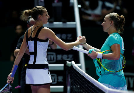 Tennis - Singapore WTA Finals Round Robin Singles - Singapore Indoor Stadium, Singapore - 26/10/2016 - Svetlana Kuznetsova of Russia (R) is congratulated by Karolina Pliskova of Czech Republic. REUTERS/Edgar Su