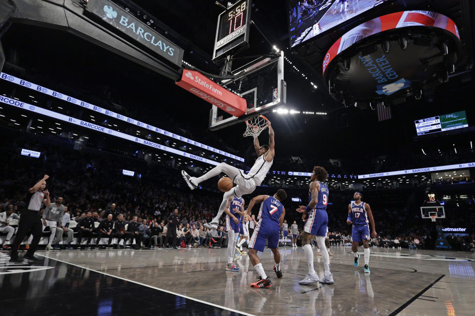 Brooklyn Nets center Nic Claxton dunks the ball against the Philadelphia 76ers during the first half of an NBA basketball game Tuesday, March 5, 2024, in New York. (AP Photo/Adam Hunger)