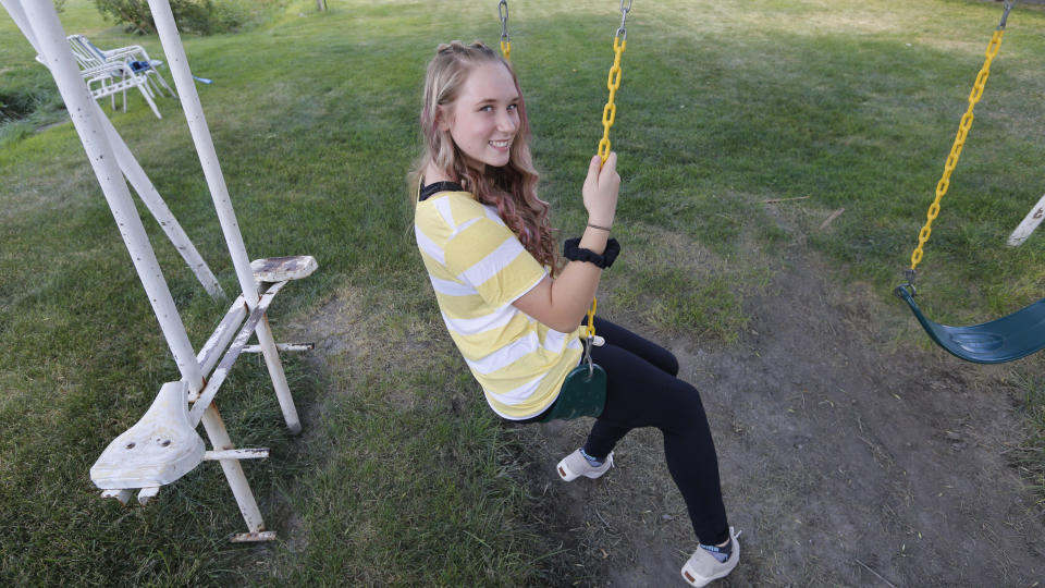 High school student Brianne Harmon is shown Monday, Aug. 10, 2020, in Magna, Utah. Harmon, 16, struggled at the end of last school year as she tried to find a quiet place to work in a remote school in a house with several relatives. She was in danger of failing three classes but after a series of sleepless nights, she managed to catch up, allowing her to continue with the drill team, a sport she loves. (AP Photo/Rick Bowmer)