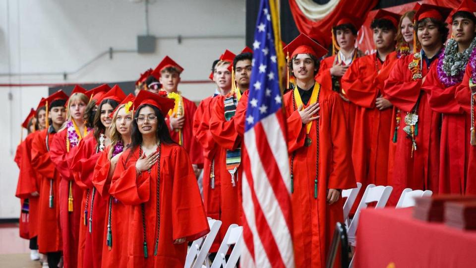 Coast Union High School graduates salute the flag during a commencement ceremoney for the Class of 2023 in Cambria on June 1, 2023.