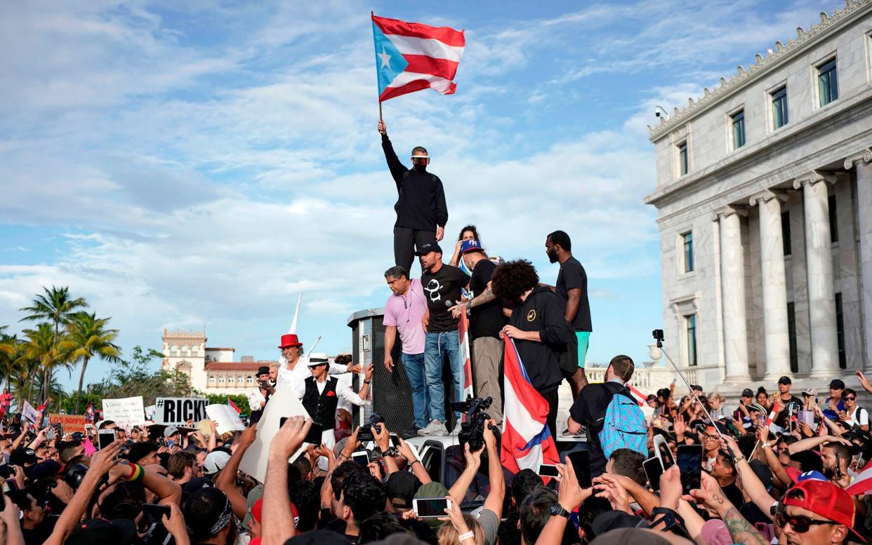 Puerto Rican singer Ricky Martin (centre) takes part in a demonstration demanding Governor Ricardo Rossello's resignation - AFP