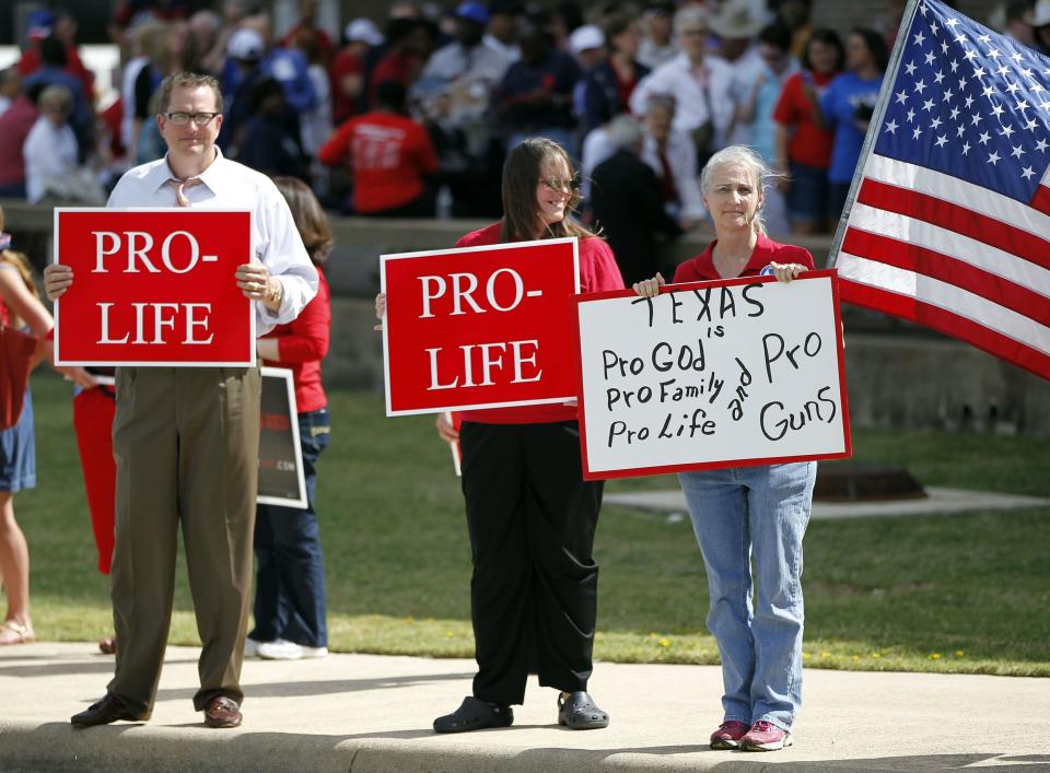 Protesters gather outside W.G. Thomas Coliseum in Haltom City