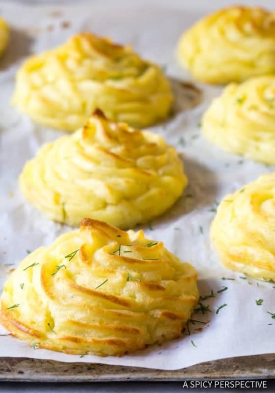 <p>A Spicy Perspective</p><p>Tired of mashed potatoes? This Thanksgiving, try this retro potato side dish. These golden pillows of potato have moist fluffy interiors and buttery crisp exteriors. </p><p><strong>Get the recipe: </strong><a href="https://www.aspicyperspective.com/perfect-duchess-potatoes/" rel="nofollow noopener" target="_blank" data-ylk="slk:The Best Duchess Potatoes;elm:context_link;itc:0;sec:content-canvas" class="link rapid-noclick-resp"><strong>The Best Duchess Potatoes</strong></a></p>