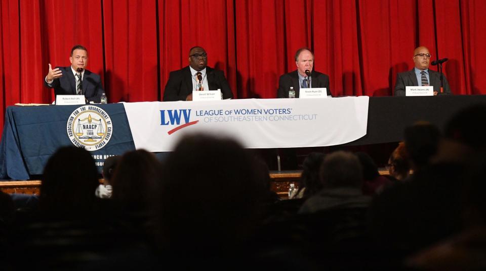 Robert Bell, left, and Derell Wilson debate for the 46th house district and incumbent Kevin Ryan and Mark Adams debate for the 139th house district October 19, 2022 at Norwich Free Academy.