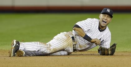 Derek Jeter injured his left ankle while trying to field the ball in the 12th inning of the ALCS opener. (AP)