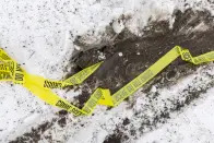 Police tape and tire tracks remain outside of the Main Street Armory on Monday, March 6, 2023, in Rochester, N.Y. (AP Photo/Lauren Petracca)