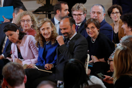 French Prime Minister Edouard Philippe and members of French government wait for the arrival of French President Emmanuel Macron at a news conference to unveil his policy response to the yellow vests protest, at the Elysee Palace in Paris, France, April 25, 2019. REUTERS/Philippe Wojazer