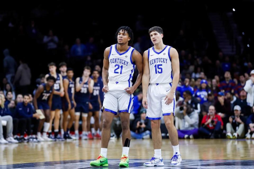 Kentucky teammates D.J. Wagner and Reed Sheppard talk during UK’s 81-66 victory over Penn in Philadelphia on Saturday.