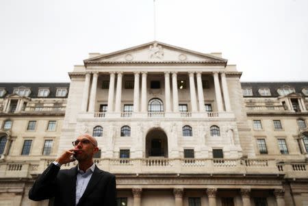 A man speaks on his mobile phone outside the Bank of England in London, Britain, October 17, 2017. REUTERS/Hannah McKay