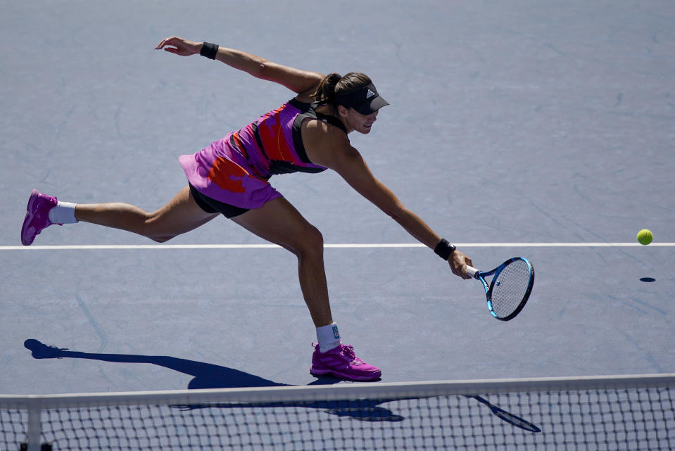 Garbine Muguruza, of Spain, returns a shot to Petra Kvitova, of the Czech Republic, during the third round of the U.S. Open tennis championships, Saturday, Sept. 3, 2022, in New York. (AP Photo/Eduardo Munoz Alvarez)