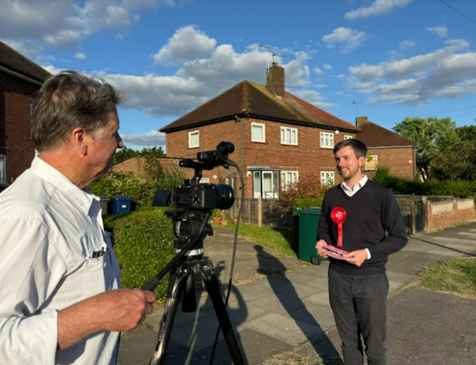 Kelly Candaele interviewing a British political candidate.