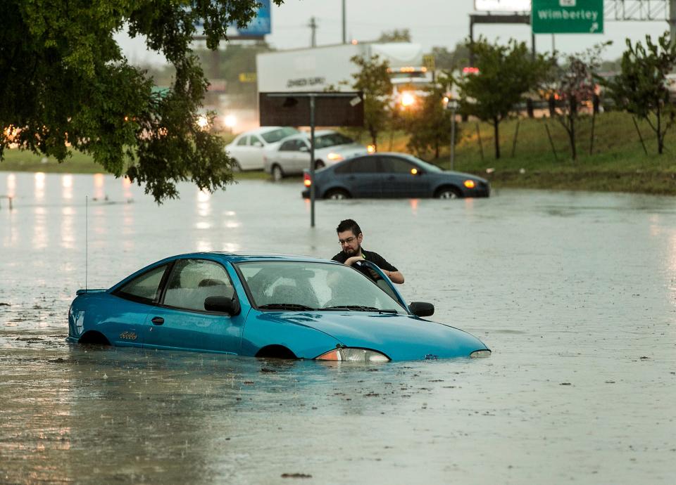 Several floods hit San Marcos in 2015, including this one in October that left a car stalled at Interstate 35 and Texas 123. The city has received a federal grant that it will use to help fund a drainage project for the Sunset Acres neighborhood.