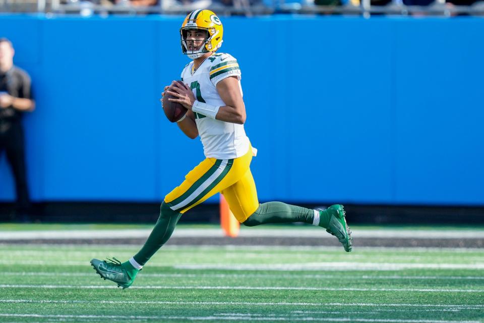 Dec 24, 2023; Charlotte, North Carolina, USA; Green Bay Packers quarterback Jordan Love (10) looks for a receiver against the Carolina Panthers during the second quarter at Bank of America Stadium. Mandatory Credit: Jim Dedmon-USA TODAY Sports