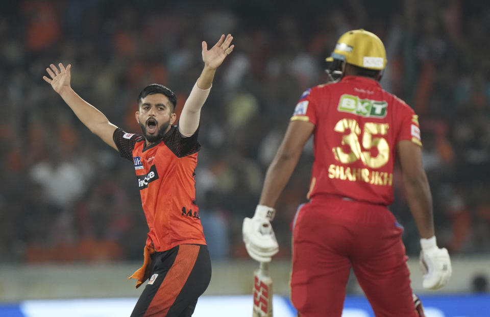 Sunrisers Hyderabad's Mayank Markande celebrates the wicket of Punjab Kings' Shahrukh Khan during the Indian Premier League (IPL) match between Sunrisers Hyderabad and Punjab Kings in Hyderabad, India, Sunday, April 9, 2023. (AP Photo/Mahesh Kumar A.)