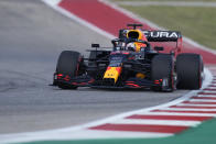 Red Bull driver Max Verstappen, of the Netherlands, drives into a turn during a practice session for the F1 US Grand Prix auto race at the Circuit of the Americas, Friday, Oct. 22, 2021, in Austin, Texas. (AP Photo/Nick Didlick)