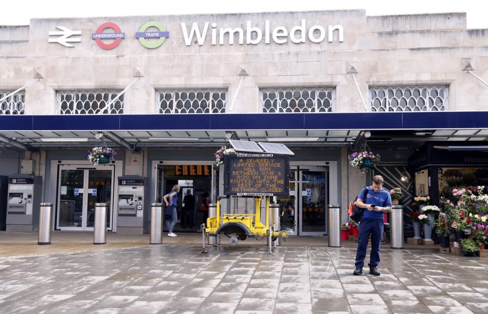 Signage warning of limited services outside Wimbledon station (Steven Paston/PA) (PA Wire)