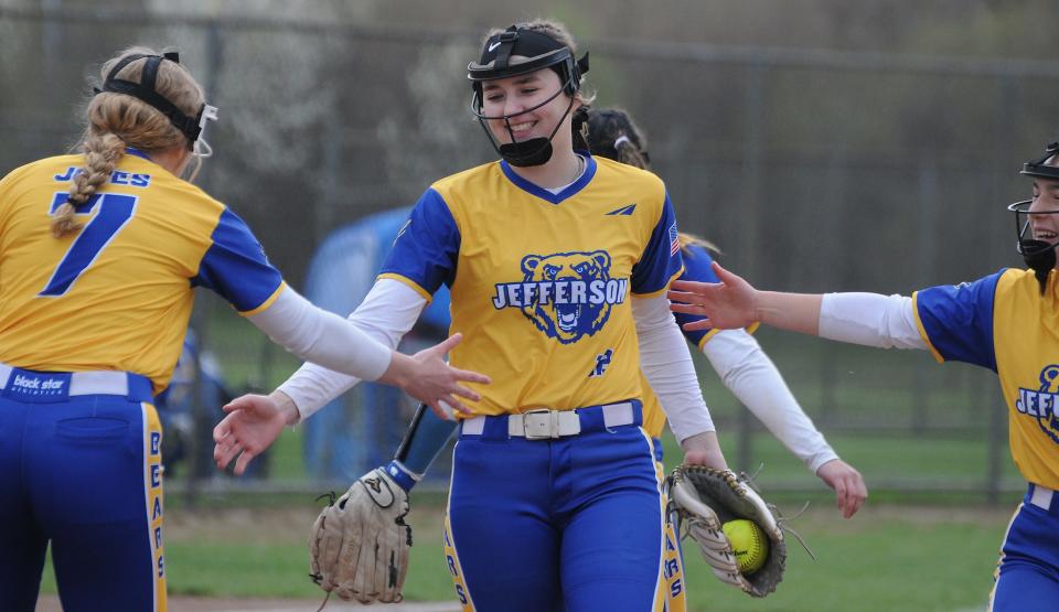 Jefferson pitcher Julia Perry is congratulated by her teammates after closing out an inning during an 8-2 victory over St. Mary Catholic Central Wednesday.