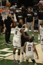 Milwaukee Bucks forward Giannis Antetokounmpo (34) shoots against Brooklyn Nets forward Jeff Green (8) during the second half of Game 6 of a second-round NBA basketball playoff series Thursday, June 17, 2021, in Milwaukee. (AP Photo/Jeffrey Phelps)