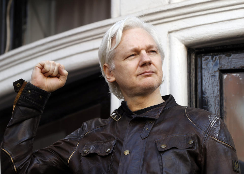 FILE - Julian Assange greets supporters outside the Ecuadorian embassy in London, May 19, 2017. WikiLeaks founder Julian Assange is facing what could be his final court hearing in England over whether he should be extradited to the United States to face spying charges. The High Court will hear two days of arguments next week over whether Assange can make his pitch to an appeals court to block his transfer to the U.S. (AP Photo/Frank Augstein, File)