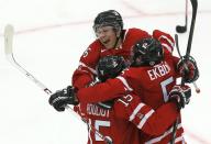 Canada's Aaron Ekblad (5) celebrates his goal against the Czech Republic with teammates Curtis Lazar and Derrick Pouliot (15) period of their IIHF World Junior Championship ice hockey game in Malmo, Sweden, December 28, 2013. REUTERS/Alexander Demianchuk (SWEDEN - Tags: SPORT ICE HOCKEY)