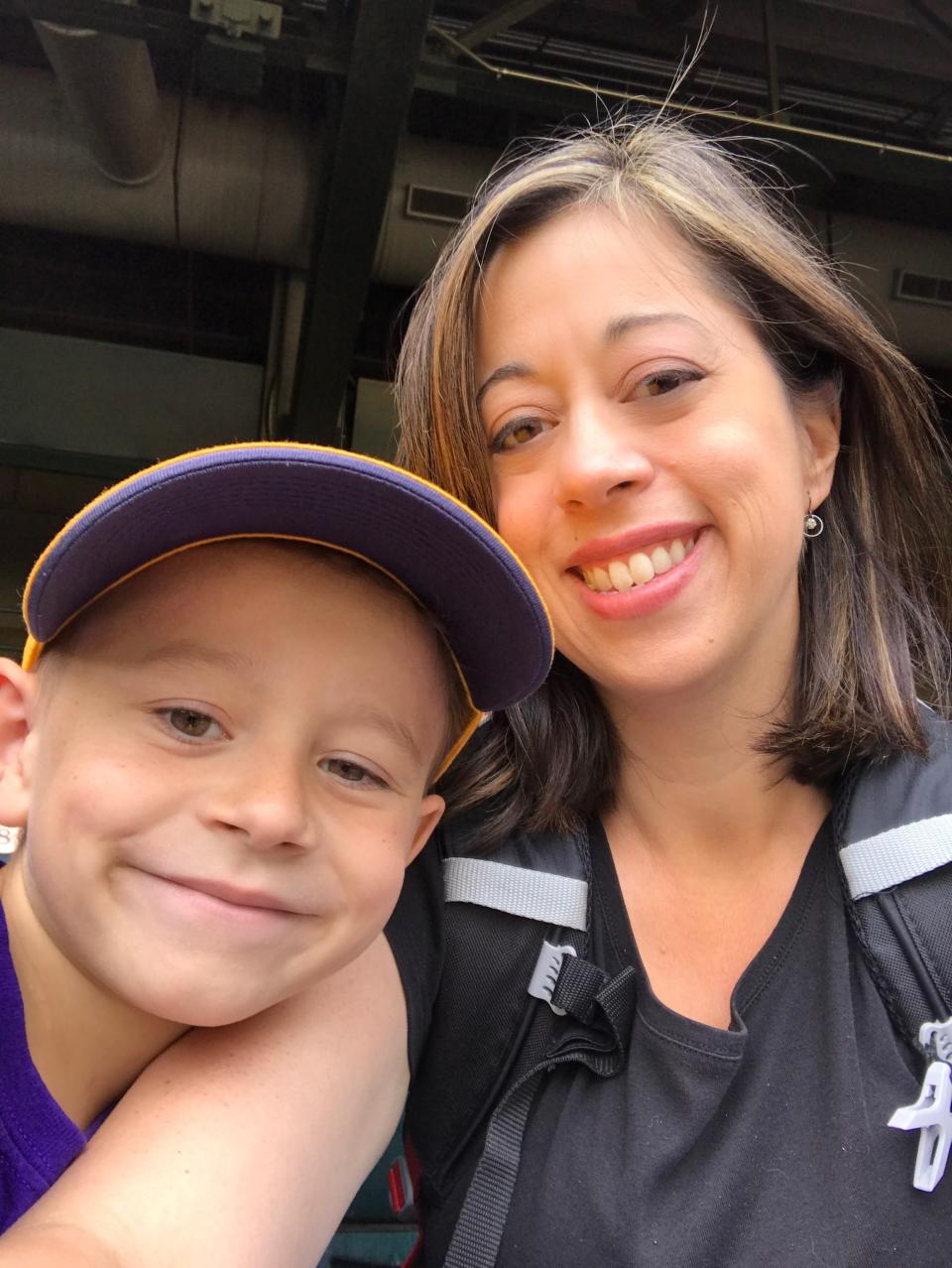 Melissa McQueen with her son, Dylan, at a school field trip at Chase field in 2017.