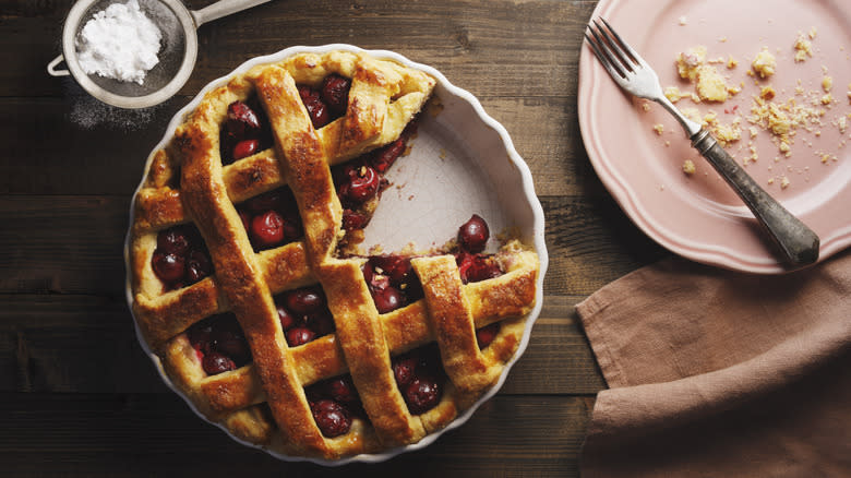 Cherry pie, plate, and fork