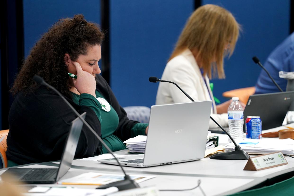 Forest Hills School District board member Sara Jones listens to public comment during a meeting, Wednesday, May 18, 2022, at Nagel Middle School in Anderson Township, Ohio. 