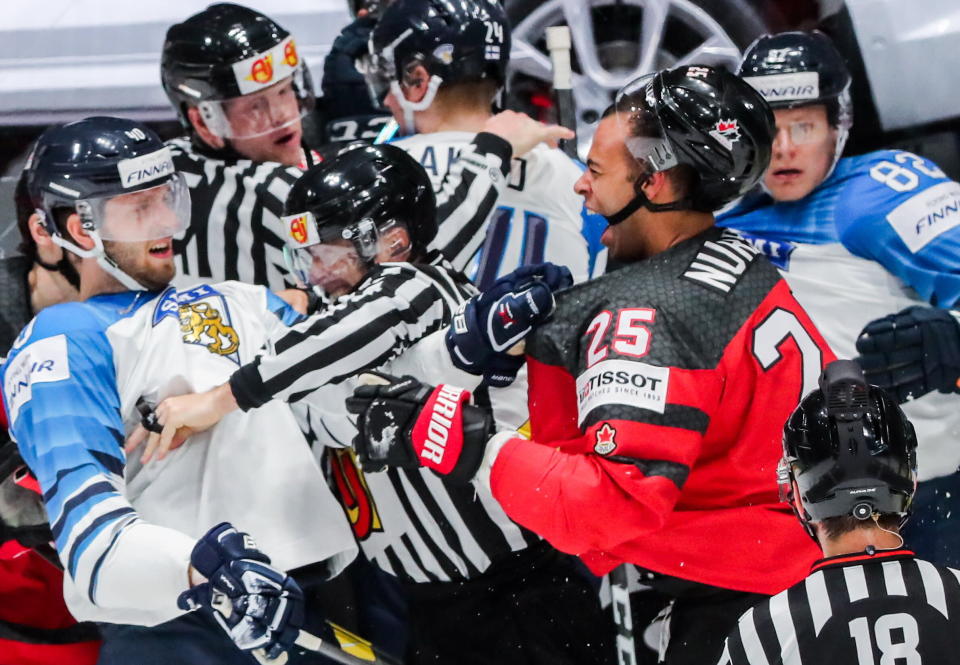 BRATISLAVA, SLOVAKIA - MAY 26, 2019: Finland's Petteri Lindbohm (L) and Canada's Darnell Nurse (R) fight in their 2019 IIHF Ice Hockey World Championship Gold medal match at Ondrej Nepela Arena. Alexander Demianchuk/TASS (Photo by Alexander Demianchuk\TASS via Getty Images)