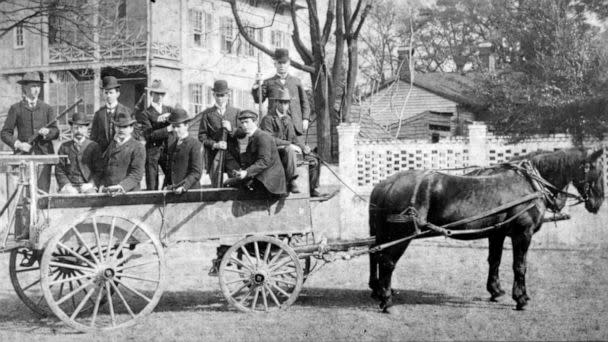 PHOTO: Men on a horse-drawn carriage on the day of the Wilmington Race Riot in 1898. (Courtesy of New Hanover County Public Library, North Carolina Room.)