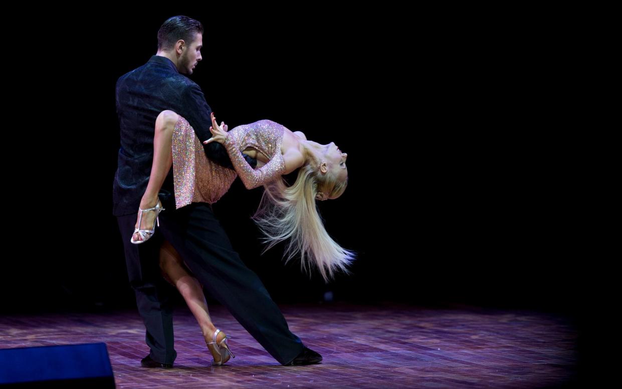 Kirill Parshakov, who was disqualified, competes with his partner Anna Gudyno at the 2015 world tango championship final in Buenos Aires - AP