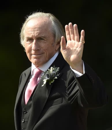 Guest, British former motor racing driver Jackie Stewart arrives for the wedding of British singer and former member of the band Spice Girls, Geri Halliwell and Christian Horner, Red Bull Formula One team principal, at St. Mary's Church at Woburn in southern England May 15, 2015. REUTERS/Toby Melville/Files
