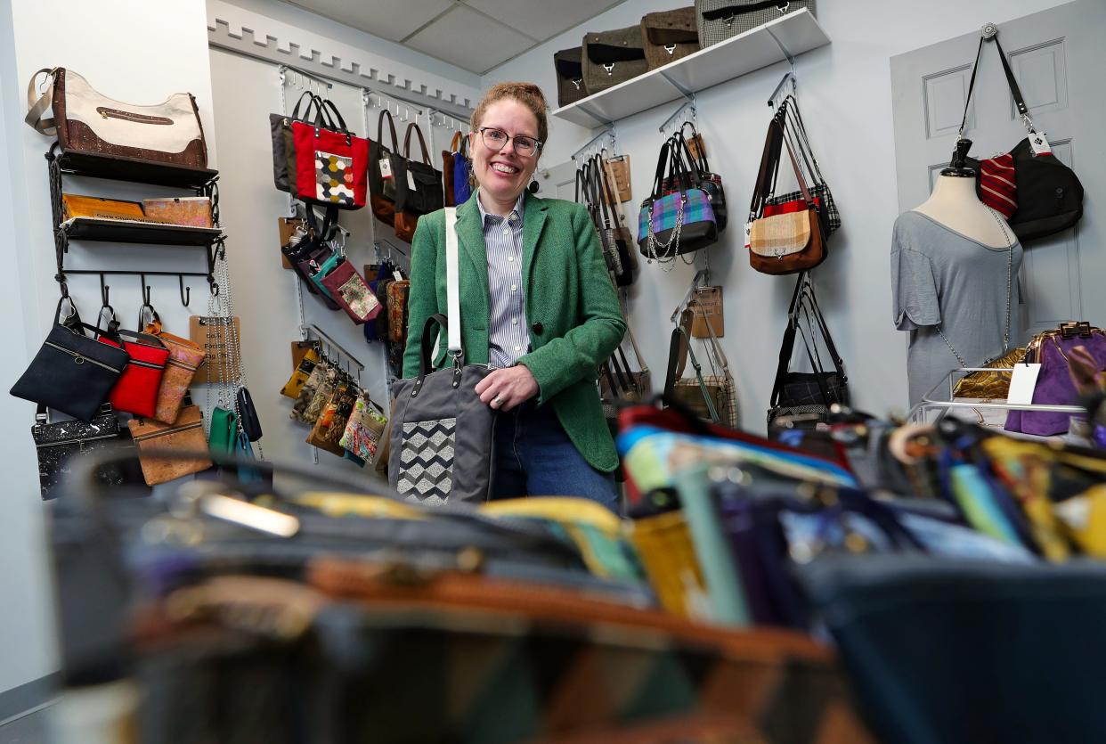 Jennifer Couch, owner of JENCI, poses for a portrait in her 130-square-foot retail space that she opens for special events and appointments at Market on Main, an area of the recently renovated building at 159 S. Main St. in downtown Akron.