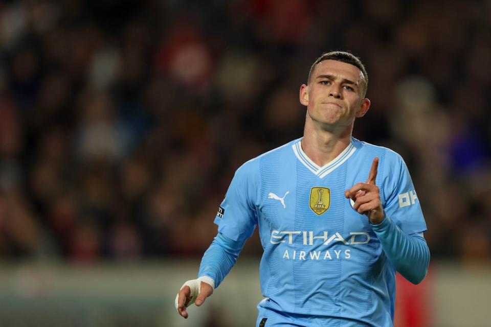 Phil Foden celebrates his hat-trick  (AP)