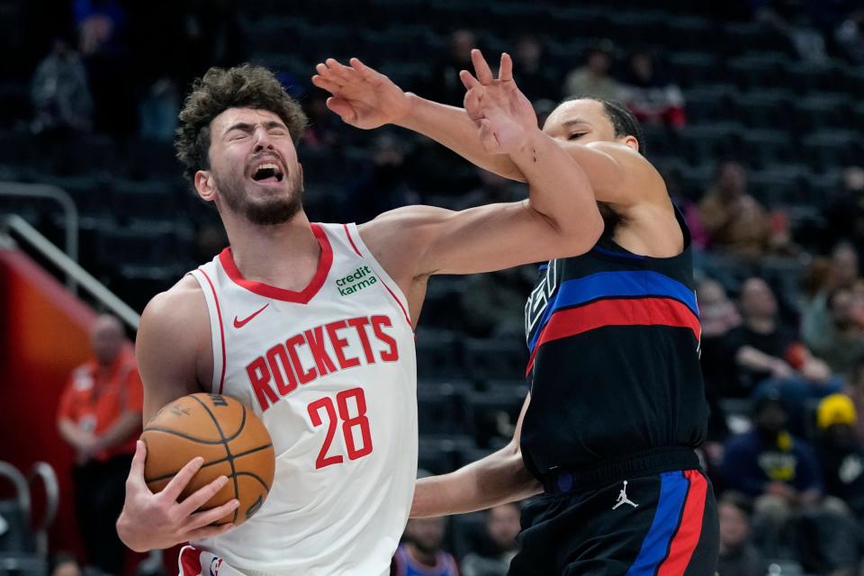 Houston Rockets center Alperen Sengun (28) is fouled by Detroit Pistons forward Kevin Knox II during the first half at Little Caesars Arena in Detroit on Friday, Jan. 12, 2024.