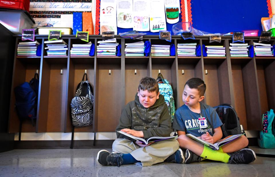 Elijah Stamper and Mason Cross read in the third grade classroom of  Andrea Davis class at Granbery Elementary Tuesday Jan. 31, 2017, in Nashville, Tenn.