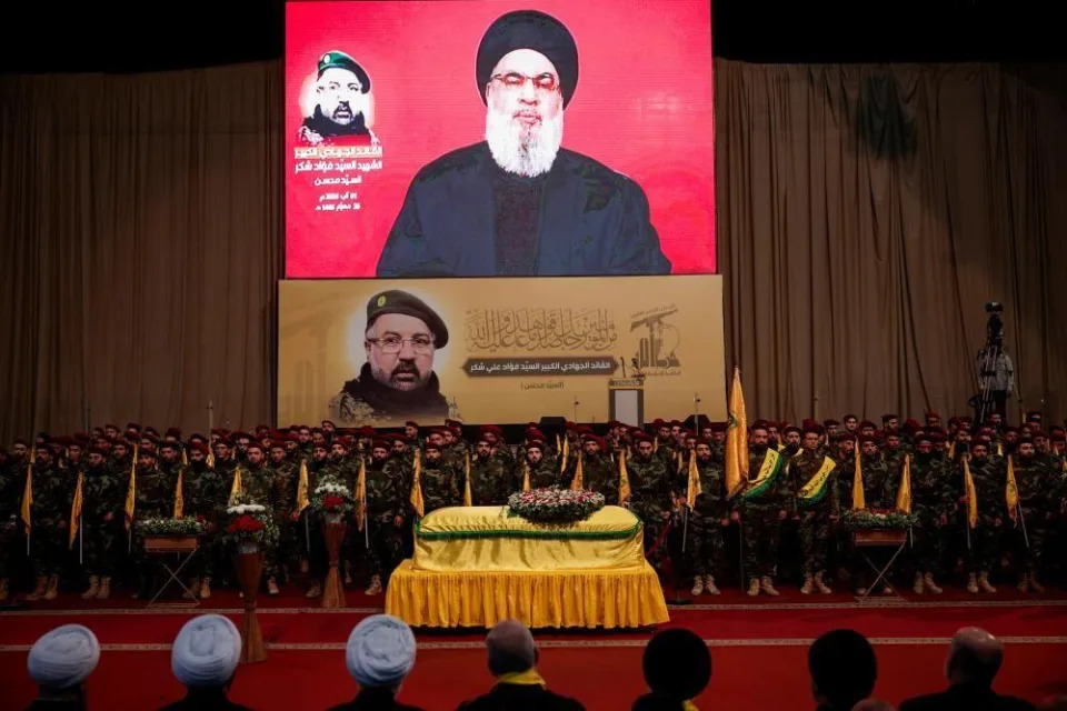 Lebanon's Hezbollah leader Sayyed Hassan Nasrallah addresses his supporters via a video display on screen during the funeral of Hezbollah senior commander Fuad Shukr, who was killed in an Israeli strike, in Beirut's southern suburbs, Lebanon August 1, 2024