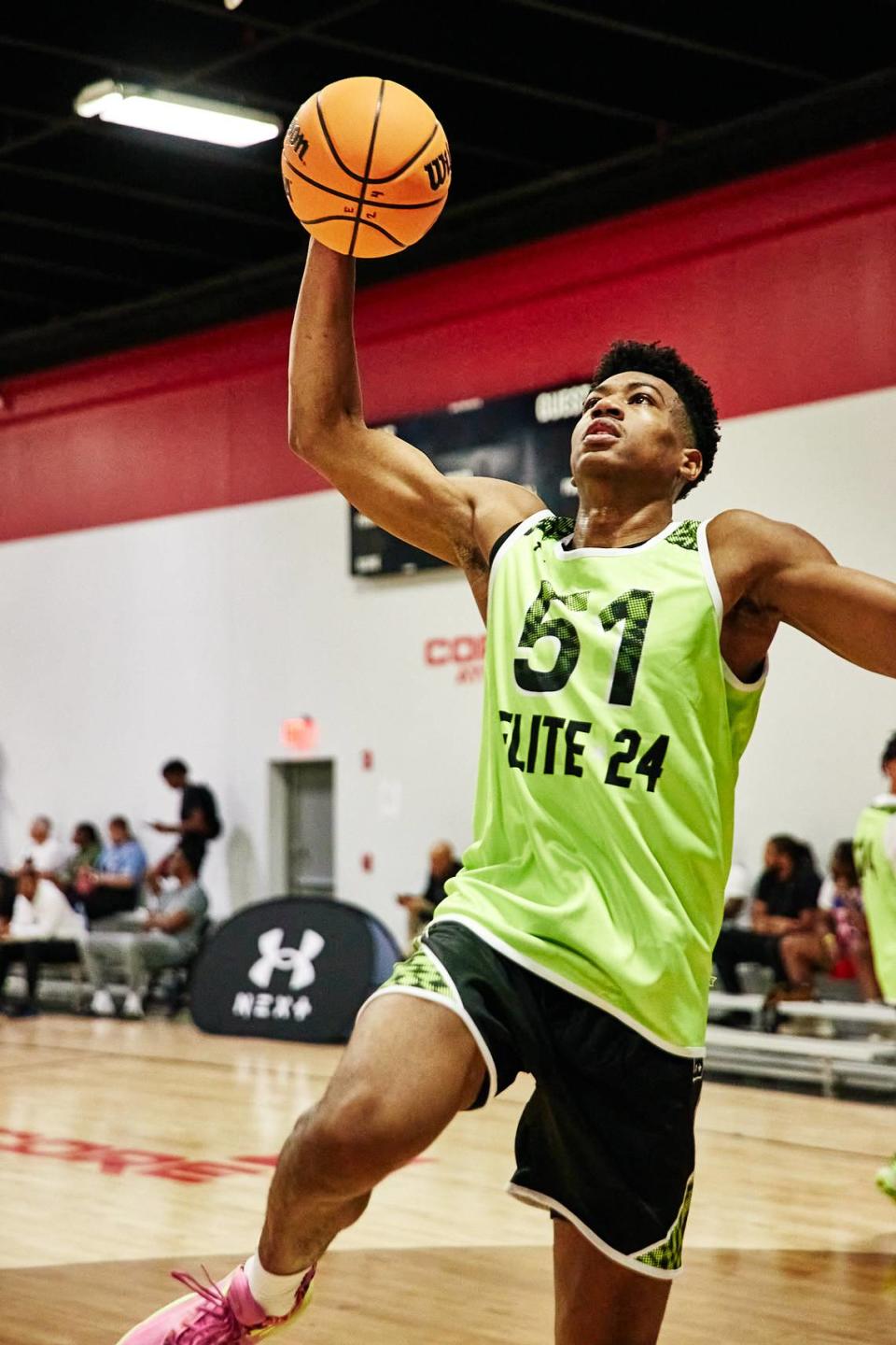 Class of 2025 college basketball recruit Bryson Tiller goes to dunk the ball during the Under Armour Next Elite 24 event in August 2023 at the CORE4 Atlanta facility in Chamblee, Georgia. Tiller has a long list of schools that have extended him a scholarship offer, but Kentucky hasn’t yet. UA Next