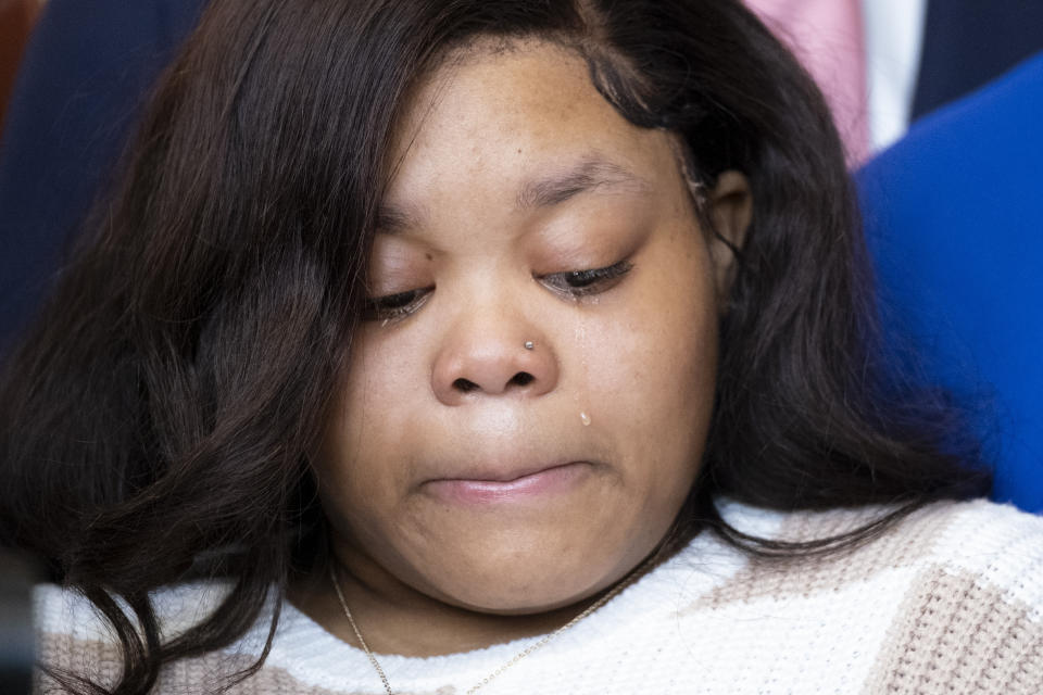 A tear rolls down Jessica Ross' cheek during a press conference about her baby, who was decapitated during delivery, during press conference, Wednesday, Feb. 7, 2024, at her lawyers office in Atlanta. (Ben Gray/Atlanta Journal-Constitution via AP)