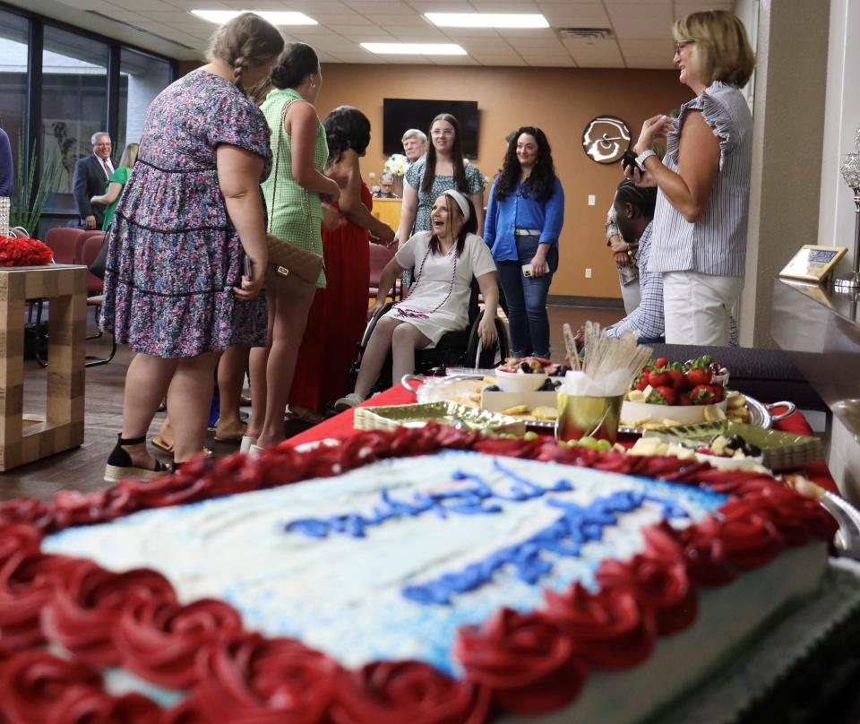 MacKenzie Maier laughs with some of her Louisiana Tech University nursing classmates at her pining ceremony at Ruston Regional Specialty Hospital on June 3.