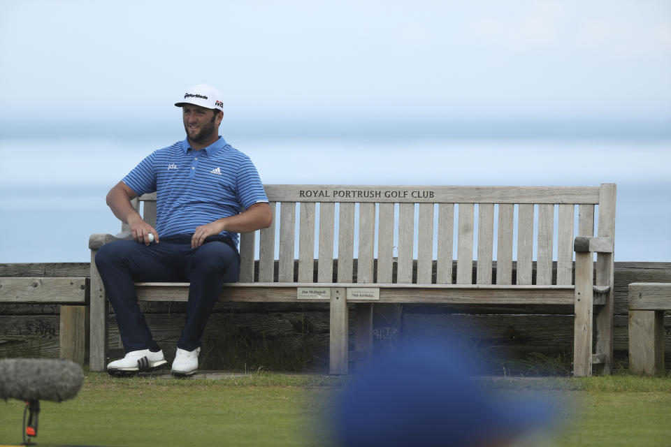 Spain's Jon Rahm sits on a bench by the 6th tee during a practice round ahead of the start of the British Open golf championships at Royal Portrush in Northern Ireland, Tuesday, July 16, 2019. The British Open starts Thursday. (AP Photo/Jon Super)